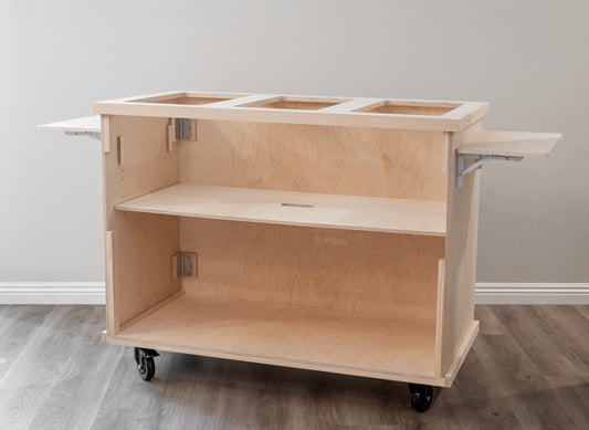 Light wood mobile charcuterie cart with open storage shelf and black caster wheels