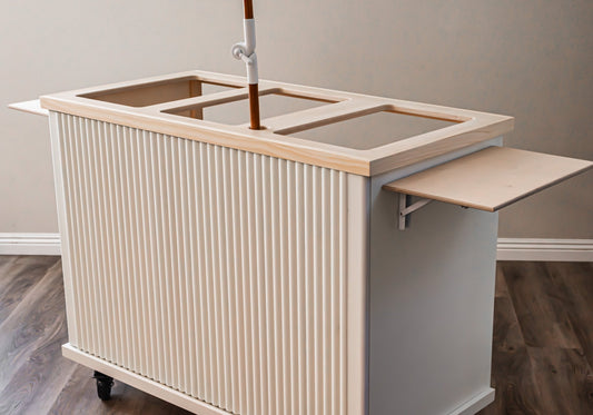 Fluted mobile cart with ribbed cream cabinet, wooden top, and side prep shelf